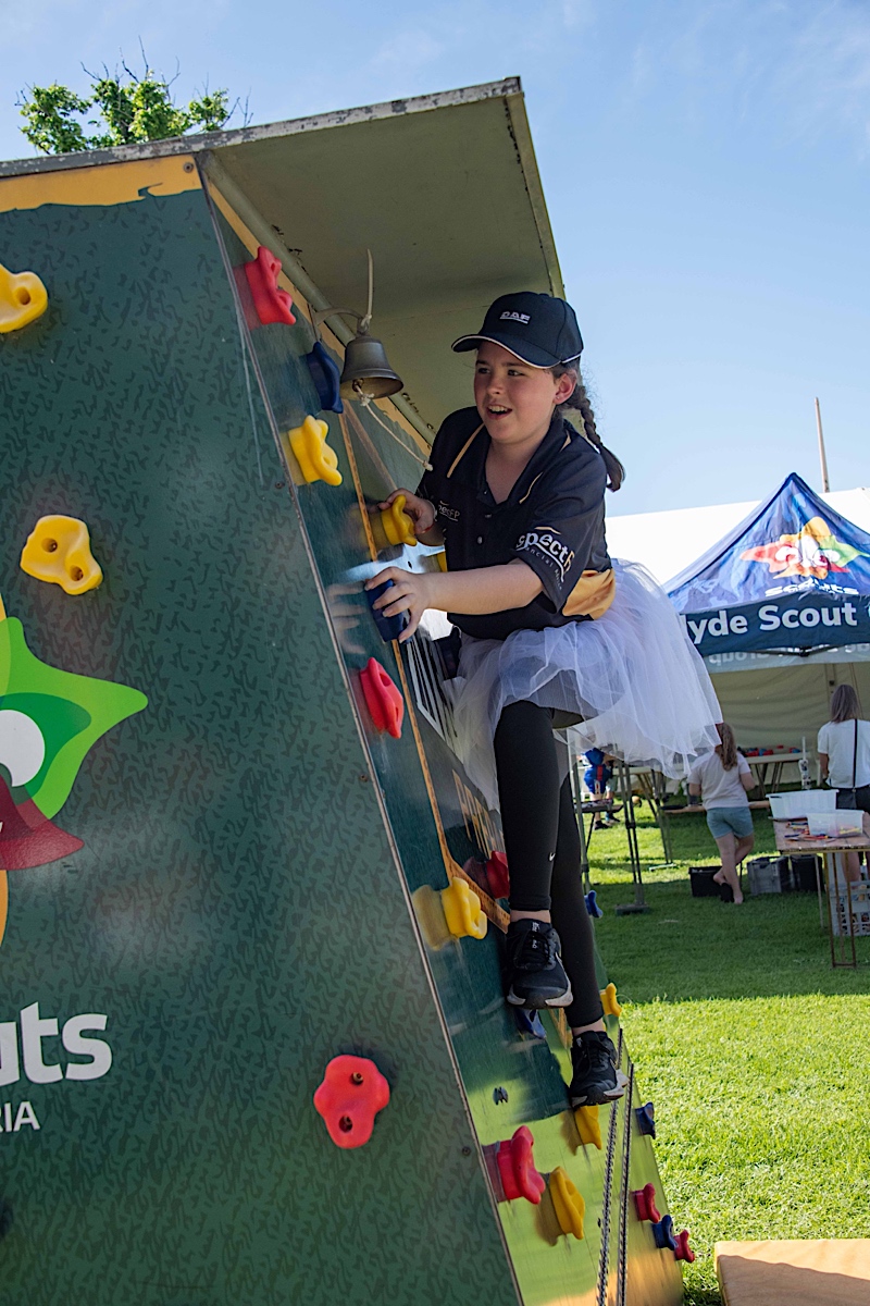 A student enjoys Scouts Victoria climbing wall