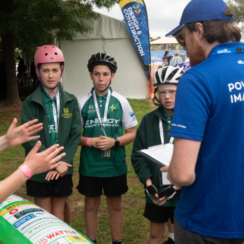 Energy Breakthrough Volunteer listening to students