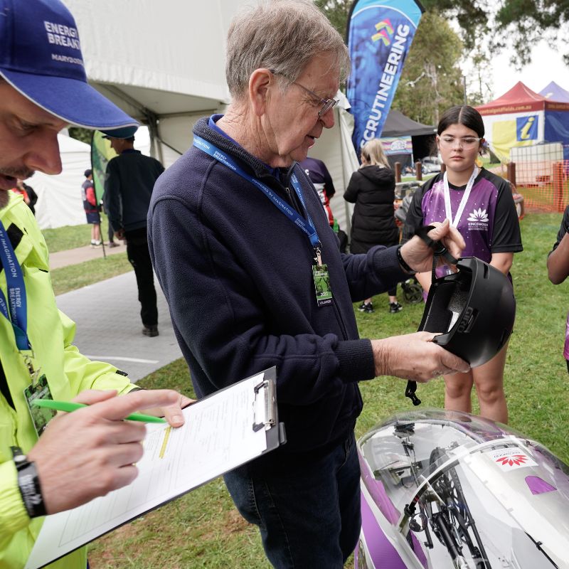 Energy Breakthrough Volunteers checking helmets